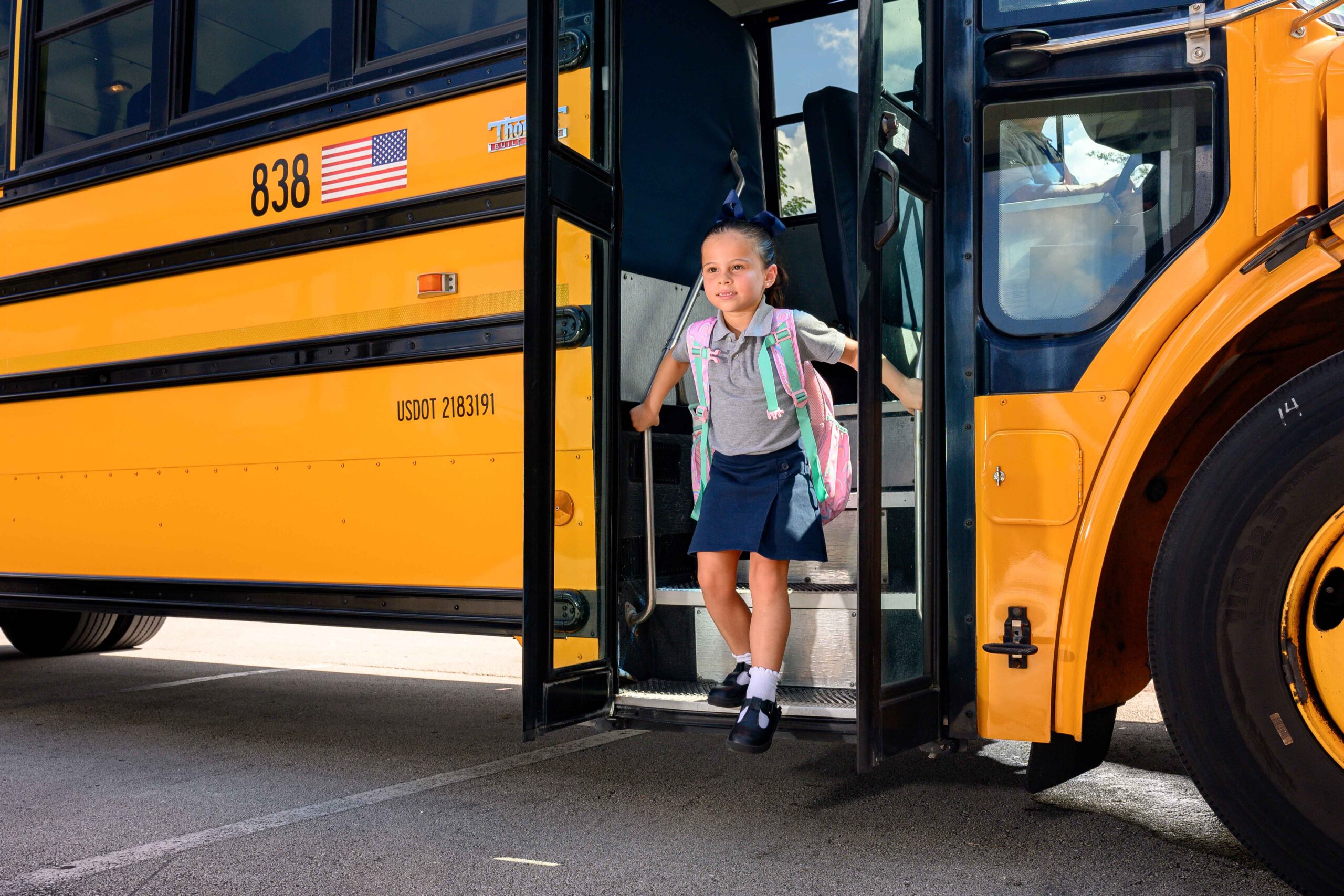 Students boarding E2E Transportation bus for field trip